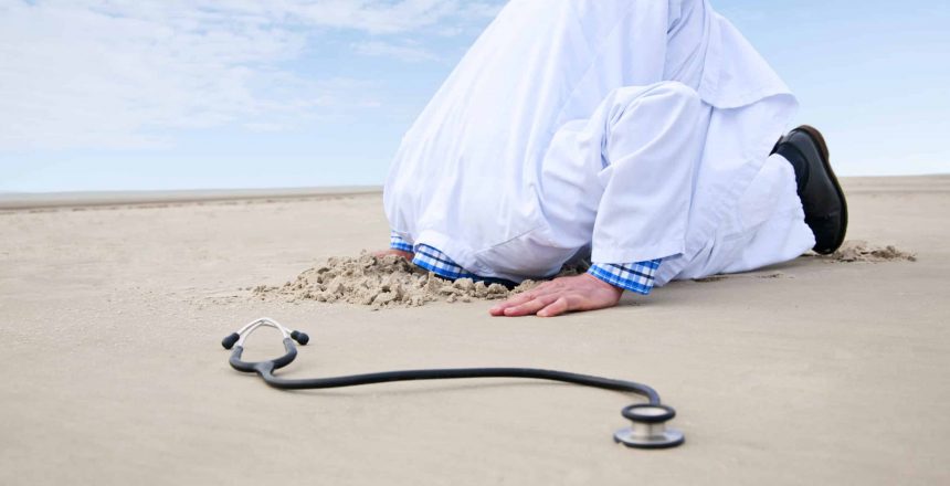 Doctor hiding head in sand. In the front a stethoscope.have a look at different variations: